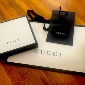 Four Gucci shopping bags